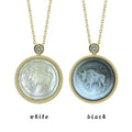Taurus zodiac relief pendant necklace carved with primitive stone texture in black and white mother-of-pearl by OceanCarvingLab.