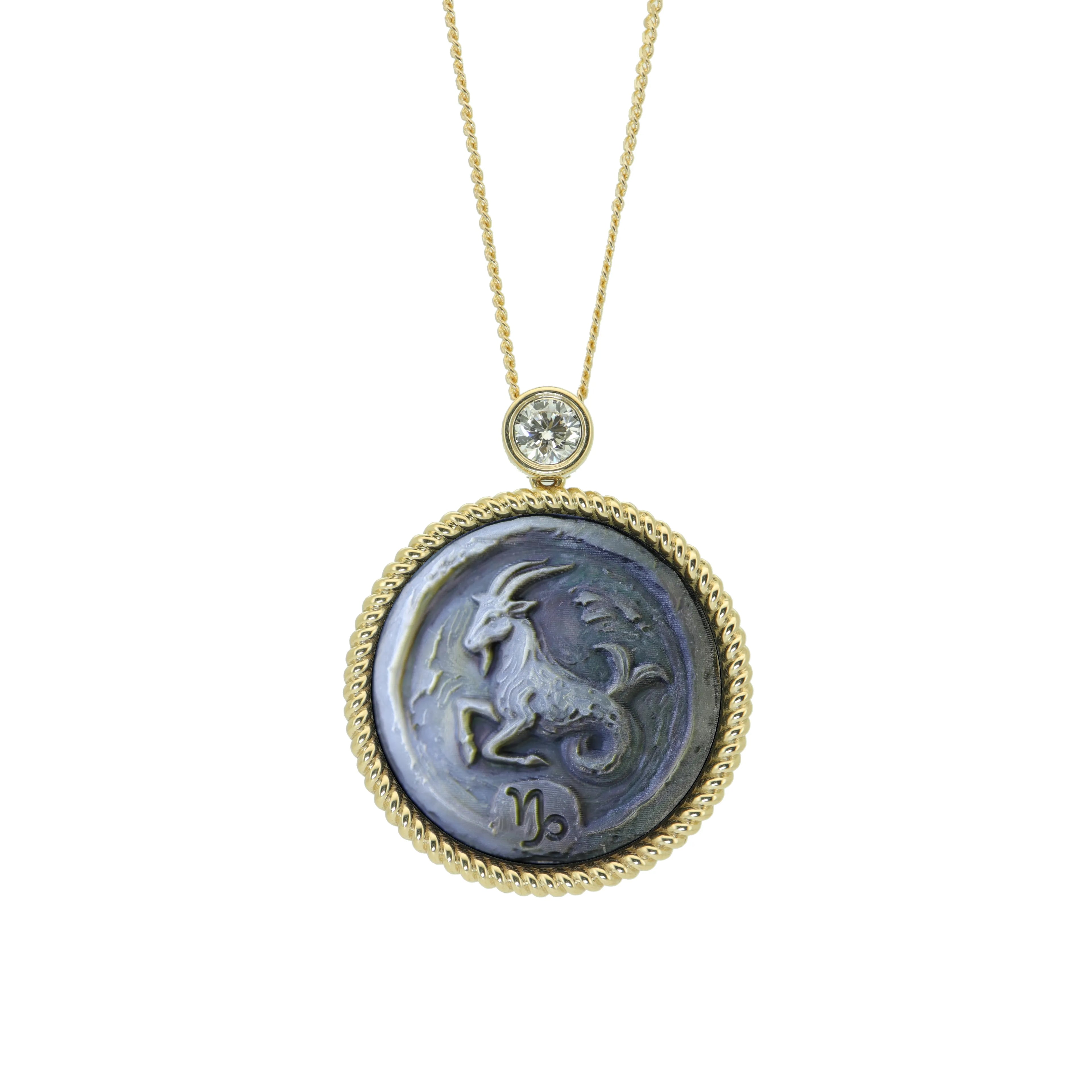 Capricorn constellation necklace featuring handcrafted Van Gogh style mother-of-pearl carving with premium gold plated sterling silver pendant by OceanCarvingLab.