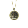 Picasso-inspired Libra zodiac pendant necklace with abstract relief textures carved from natural mother-of-pearl by OceanCarvingLab.