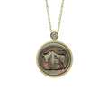 Picasso-inspired Taurus zodiac pendant necklace featuring abstract modernist mother-of-pearl relief carving with gold plated sterling silver setting by OceanCarvingLab.