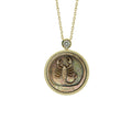 Avant-garde Scorpio zodiac necklace featuring mysterious abstract shell carving and iridescent mother-of-pearl pendant by OceanCarvingLab.