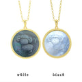 Two Aries zodiac necklaces featuring black and white mother-of-pearl inlays with kawaii pixel carving texture on white background by OceanCarvingLab.