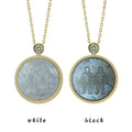 wo Gemini zodiac pendant necklaces with carved black and white mother-of-pearl inlay on white background by Celestial Creations.