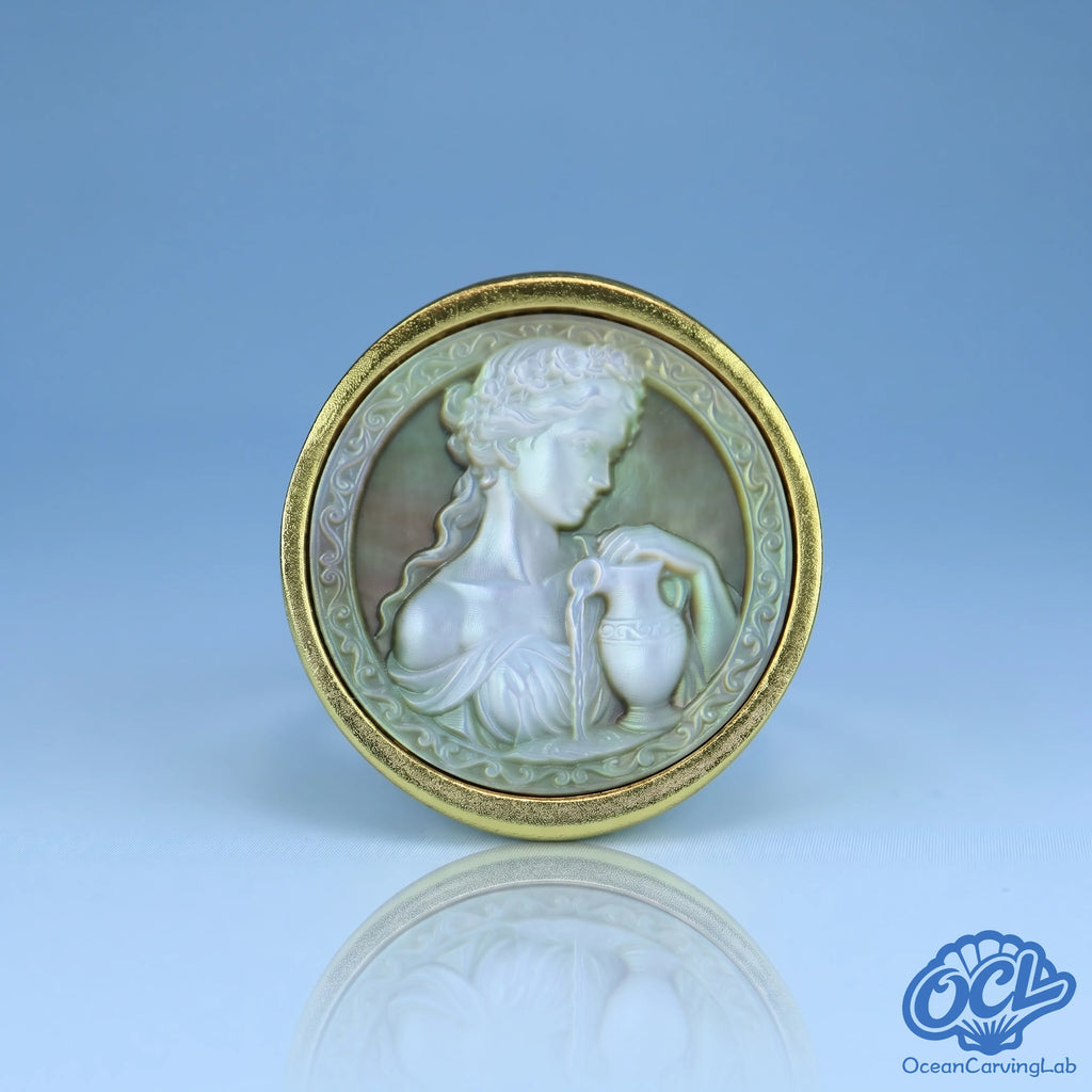 Aquarius water-bearer zodiac ring, 24k gold plated brass with a 17mm white mother of pearl disc.