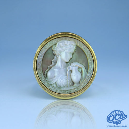 Aquarius water-bearer zodiac ring, 24k gold plated brass with a 17mm white mother of pearl disc.