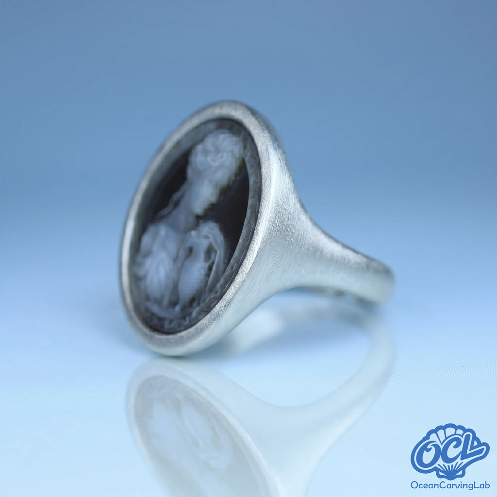 Visionary Aquarius ring with a modern geometric gold finish and manual shell inlay.