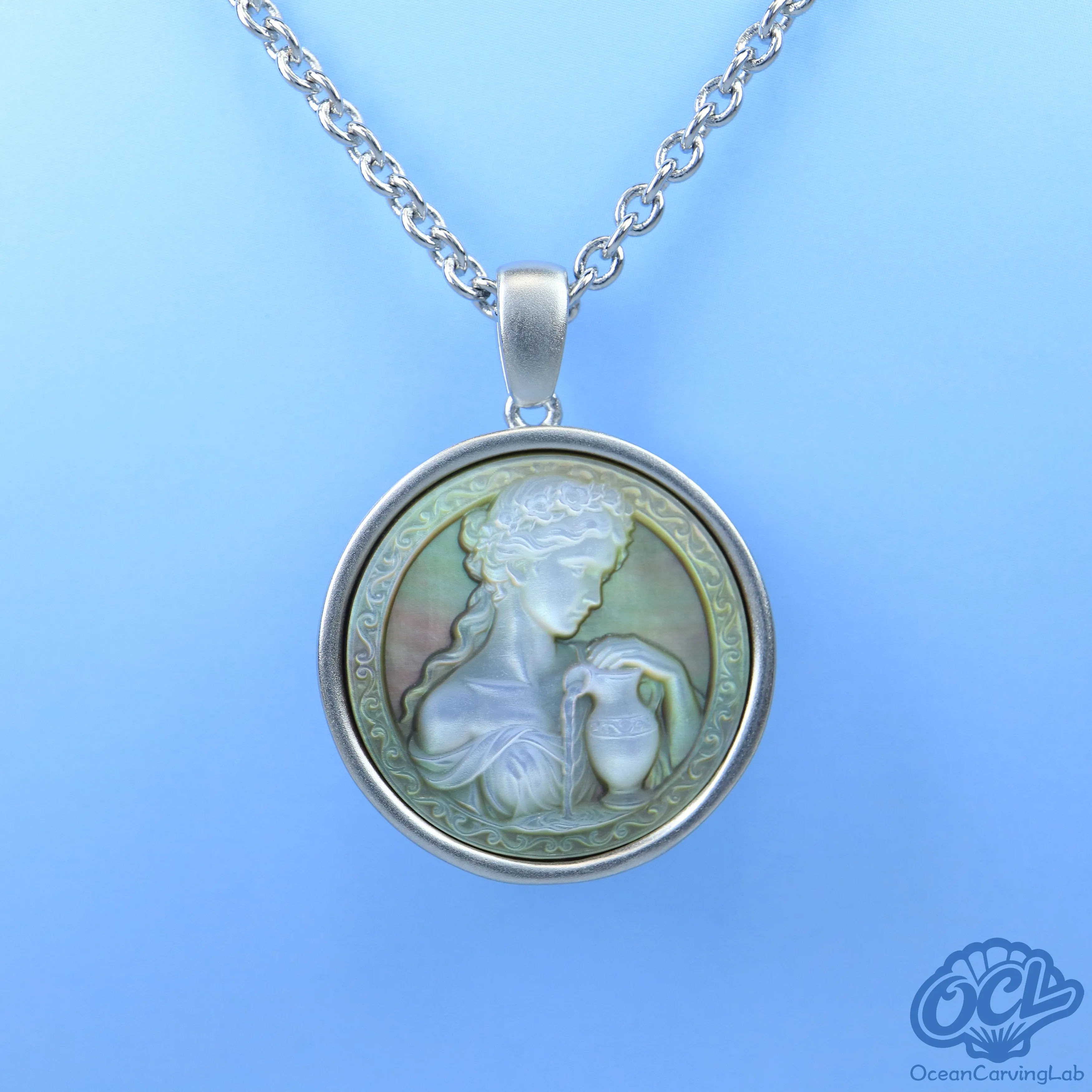 Detailed Aquarius constellation engraved on iridescent black nacre for a mysterious look.