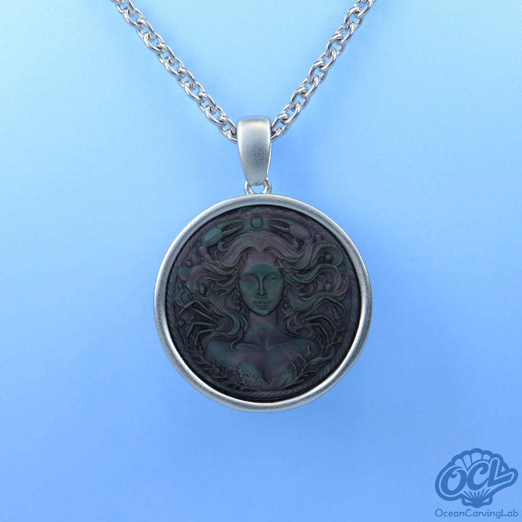 Detailed Cancer constellation engraved on black iridescent mother of pearl for a night sky look.