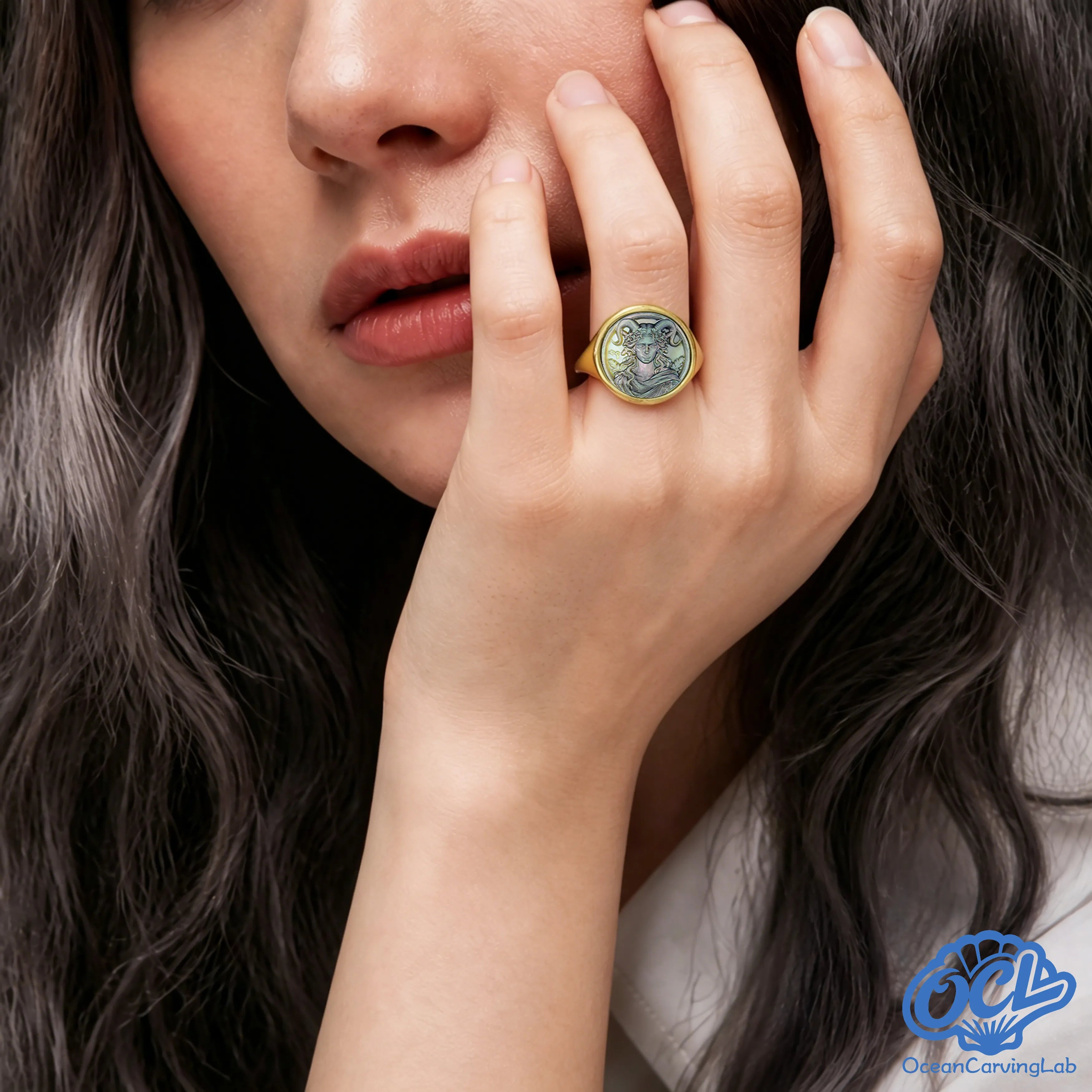 Side view of the Capricorn ring showing a solid gold-plated band and meticulously set shell.