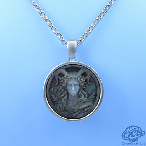 Detailed Capricorn sea-goat figure on white iridescent mother of pearl, reflecting bright light.