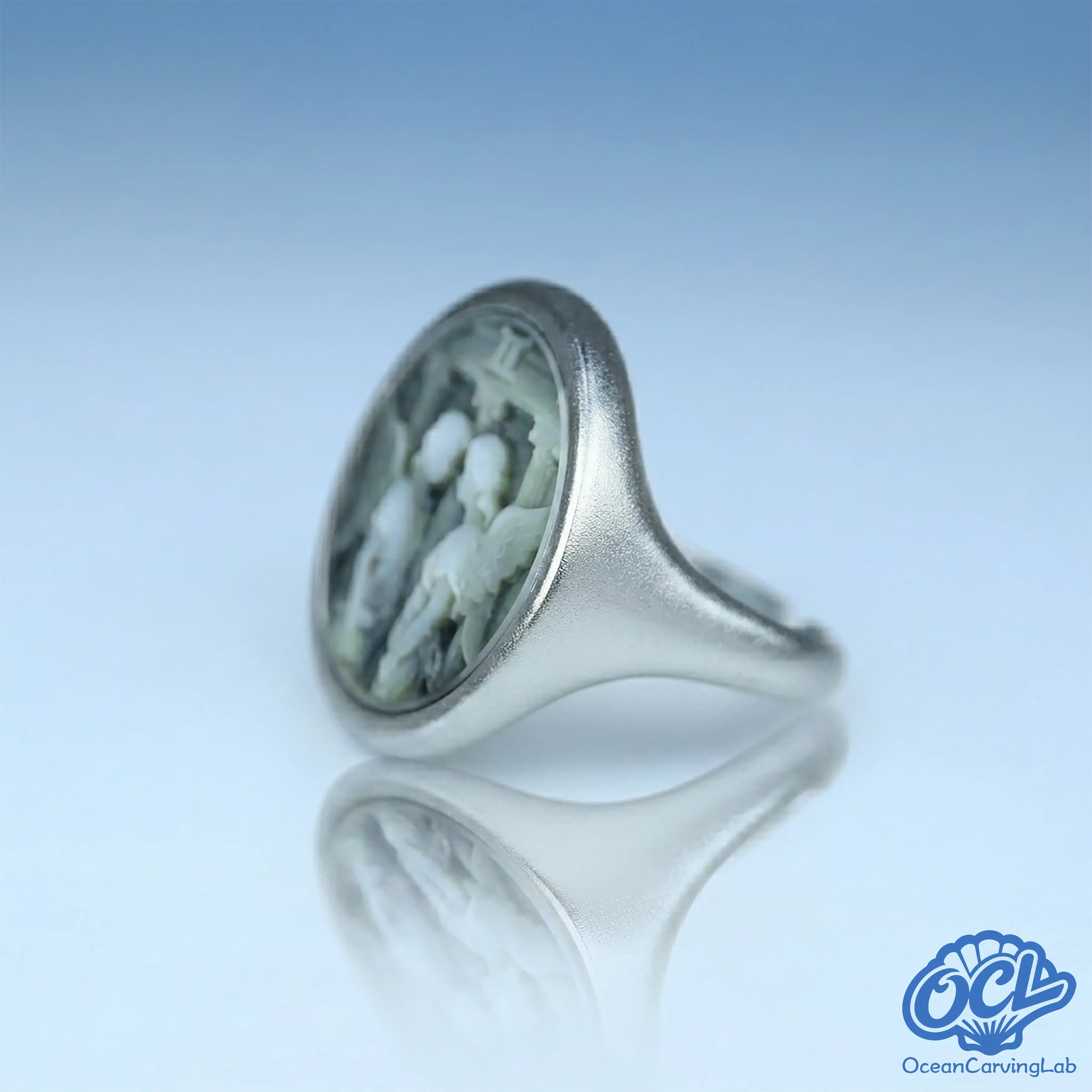 Modern Gemini statement ring with a high-luster gold finish and natural shell inlay. 