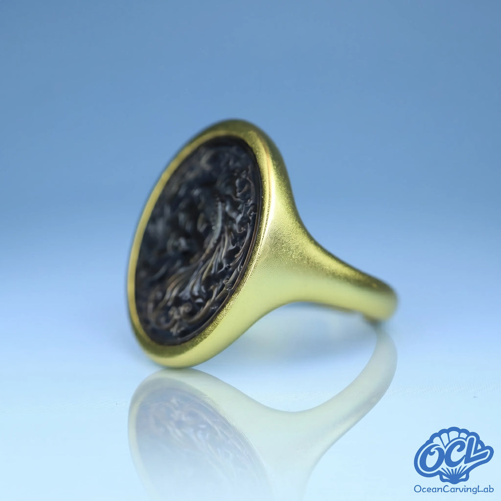 Mystical Pisces fishes figure engraved on iridescent black shell using precision CNC technology.
