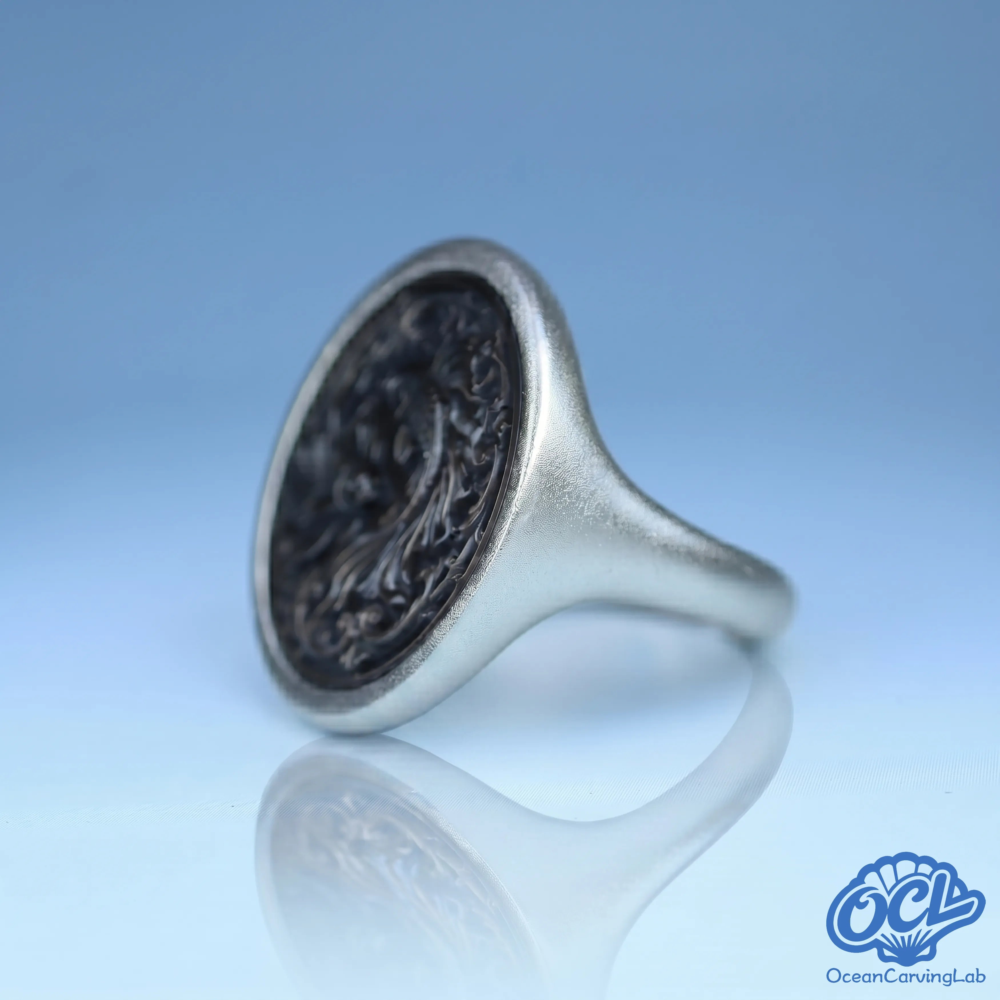 Whimsical Pisces ring with a high-luster gold finish and manual shell inlay for an organic feel.