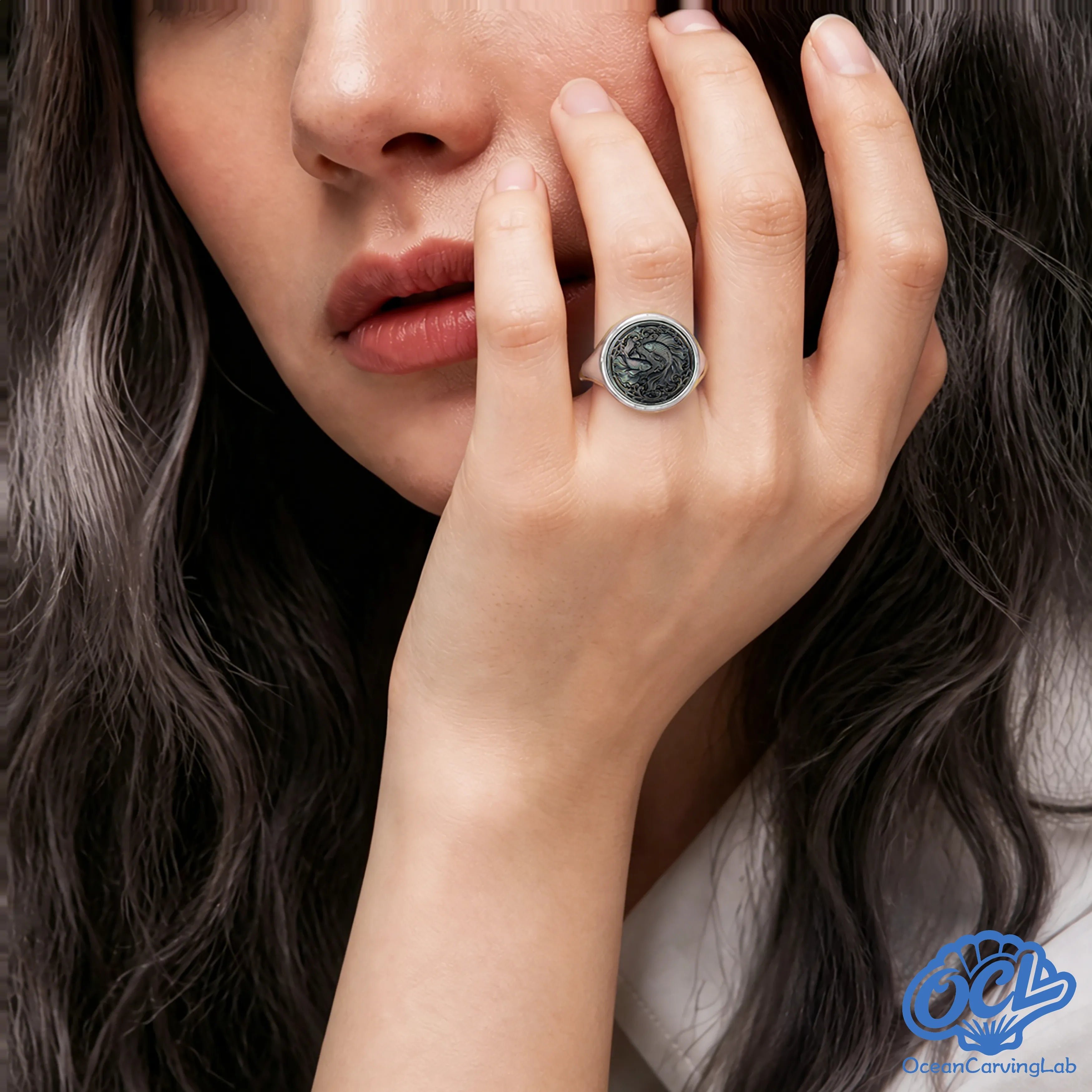 Dreamy Pisces zodiac ring worn on a hand, reflecting a soft and magical nacre luster.