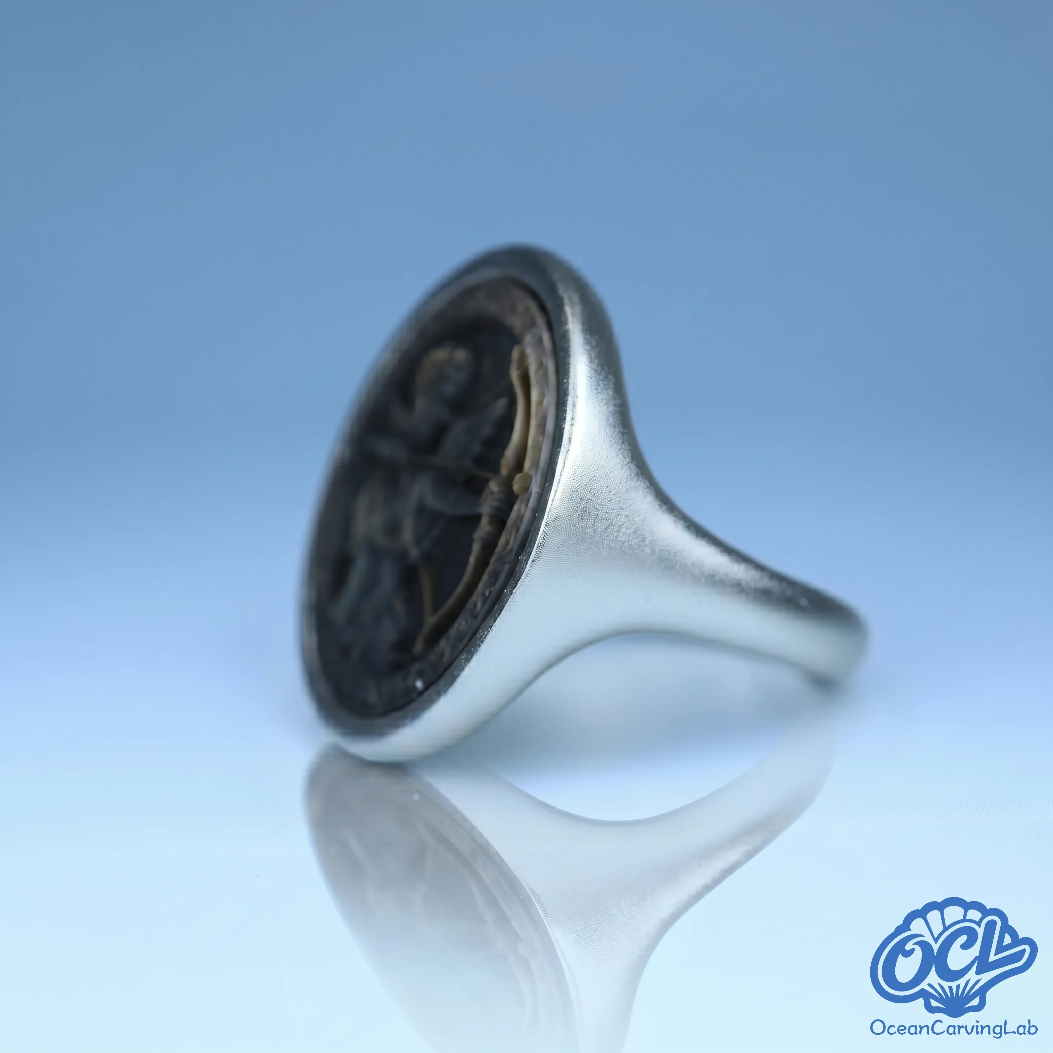 Adventurous Sagittarius ring with a polished gold finish and natural pearlescent textures.