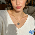 Manufacturing a Sagittarius necklace: from 3D modeling to manual shell inlaying.