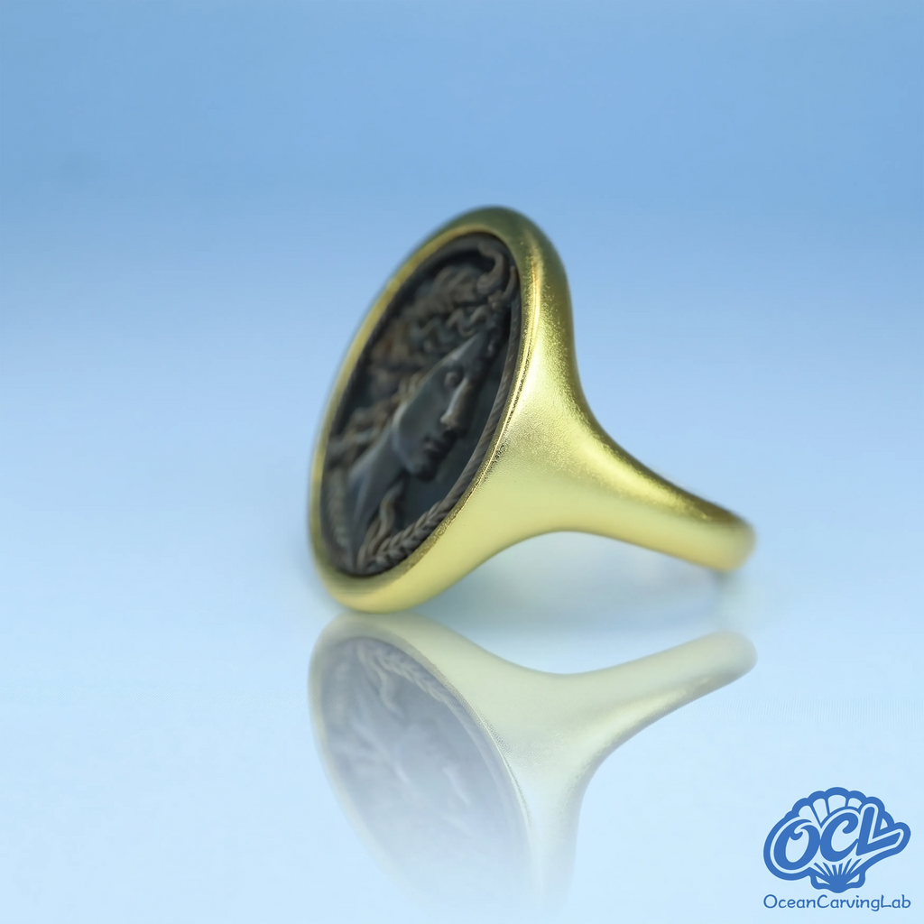 Taurus bull figure engraved using precision CNC on natural iridescent black shell surface.