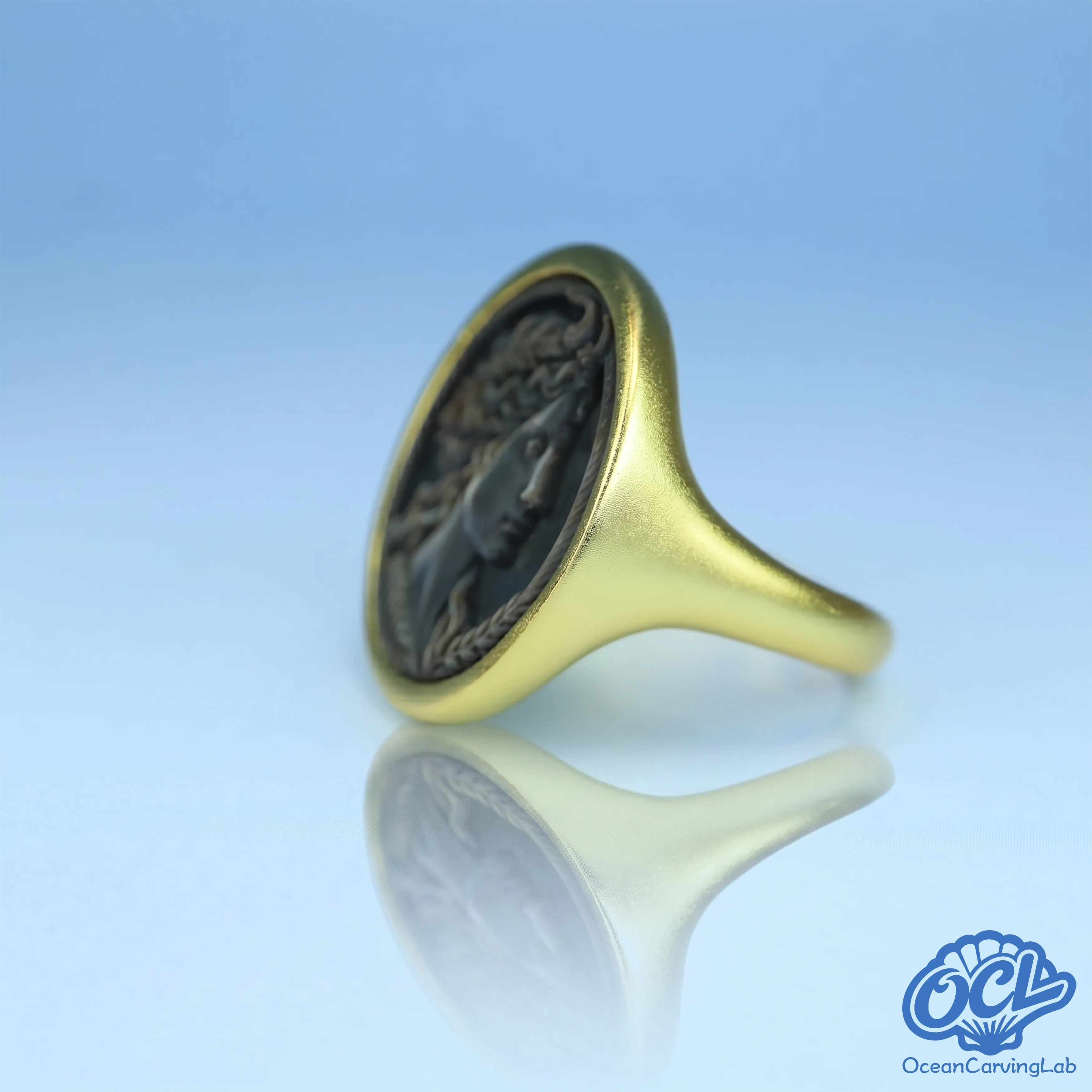 Taurus bull figure engraved using precision CNC on natural iridescent black shell surface.