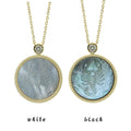 Two Scorpio zodiac pendant necklaces with carved black and white mother-of-pearl inlay on white background by Celestial Creations.