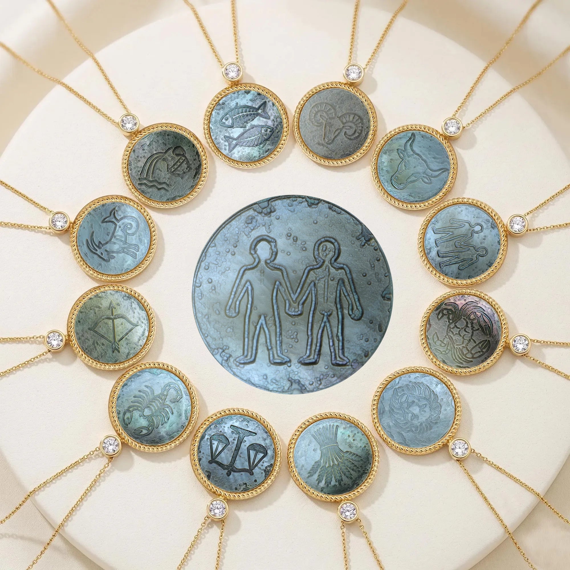 Iridescent carved mother-of-pearl pendant necklace set featuring all 12 zodiac constellations by Celestial Creations.