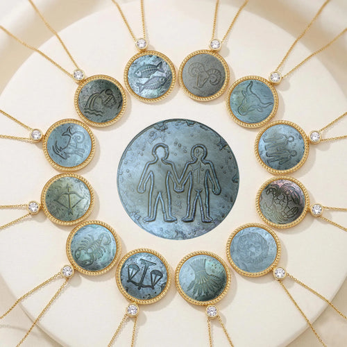 Iridescent carved mother-of-pearl pendant necklace set featuring all 12 zodiac constellations by Celestial Creations.